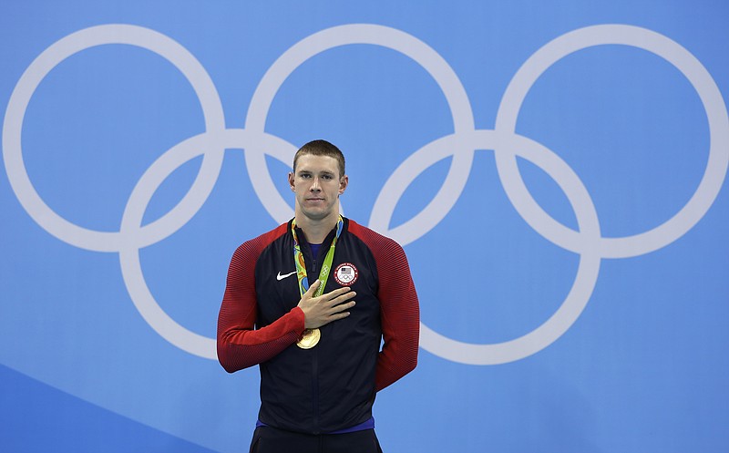 United States' gold medal winner Ryan Murphy listens to the anthem during the medal ceremony for the men's 200-meter backstroke final on Aug. 11, 2018, during the swimming competitions at the 2016 Summer Olympics in Rio de Janeiro, Brazil. The last time the American men lost a backstroke race at the Olympics, Ryan Murphy wasn't even born. It's likely up to him to keep the remarkable streak alive. - Photo by Michael Sohn of The Associated Press