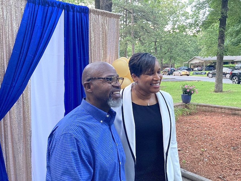 Delton Wright and Pam Smith, chief of police of the United States Parks Police, share a moment with a well-wisher at a recent reception Wright hosted for Smith, who is from Pine Bluff. (Pine Bluff Commercial/Byron Tate)