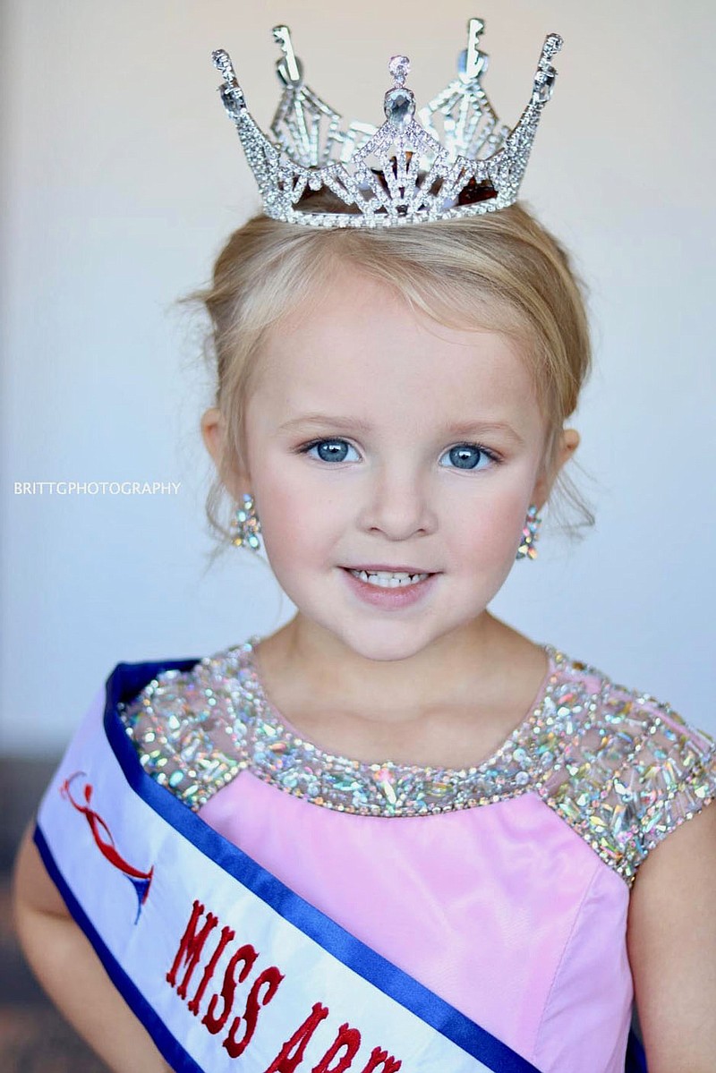 Submitted Photo
Clara Kate Edwards, of Gravette, wears the crown and sash she earned when she won the title of Miss Arkansas Elementary Preschool at the 2021 Miss Arkansas Elementary Pageant in Little Rock in mid-January. Clara will be completing in the Miss Elementary America national pageant next week, also in Little Rock.