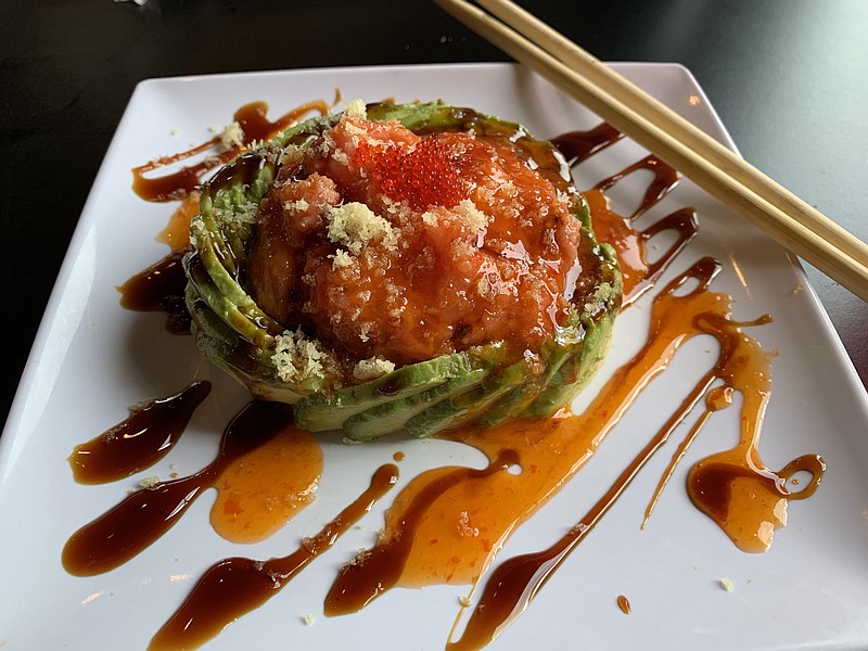 Twisted Tuna, spicy tuna "dammed" by a wall of sliced avocado, is one of Rock N Roll Sushi's "greatest hits." (Arkansas Democrat-Gazette/Eric E. Harrison)