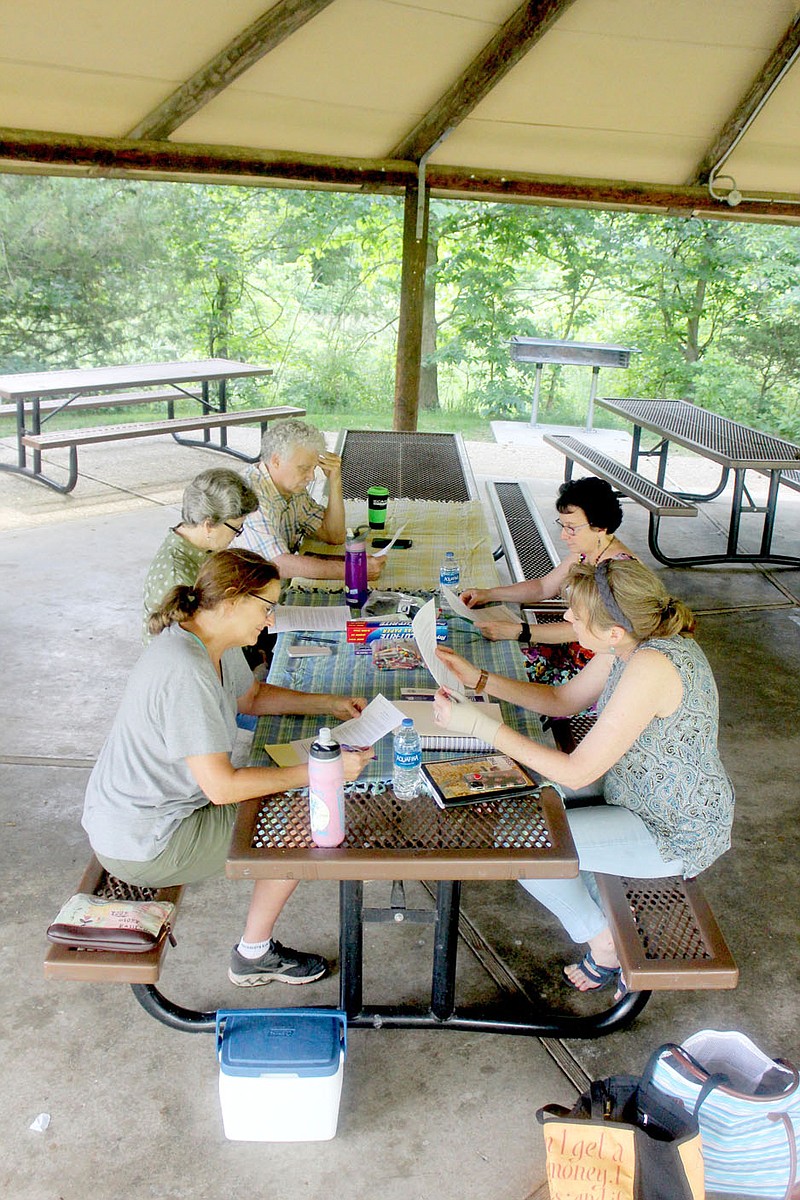 Keith Bryant/The Weekly Vista
The Village Lake Writers and Poets group sits down to discuss a few pieces of writing at the Tanyard Creek pavilion.