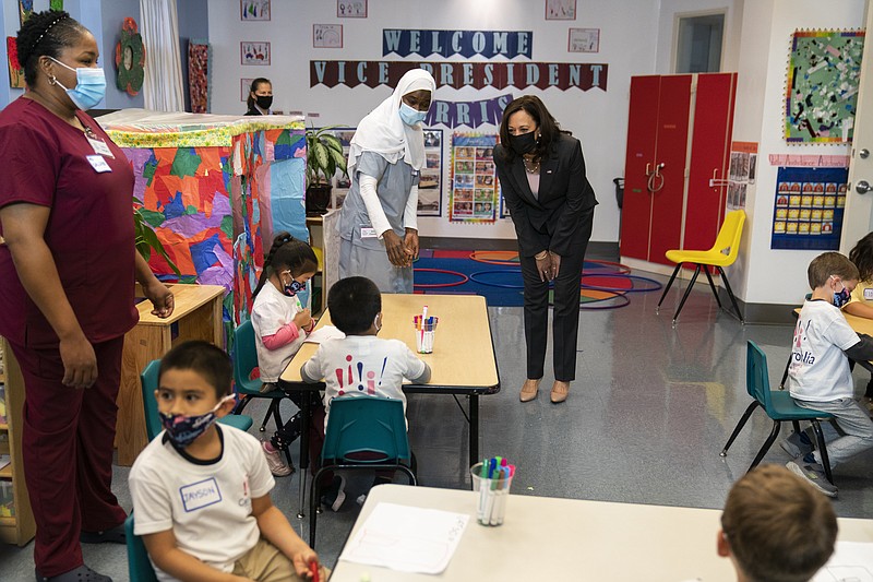 Vice President Kamala Harris greets bilingual early childhood education school CentroNia pupils during a visit to the school, Friday, June 11, 2021 in northwest Washington. Harris talked about child tax credit during the visit. (AP Photo/Manuel Balce Ceneta)
