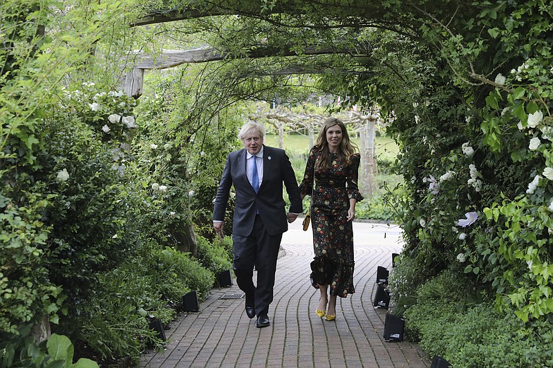 Britain's Prime Minister Boris Johnson and wife Carrie Johnson arrive for a G7 leaders reception at the Eden Project in Cornwall, England, Friday June 11, 2021, during the G7 summit. (Jack Hill/Pool via AP)