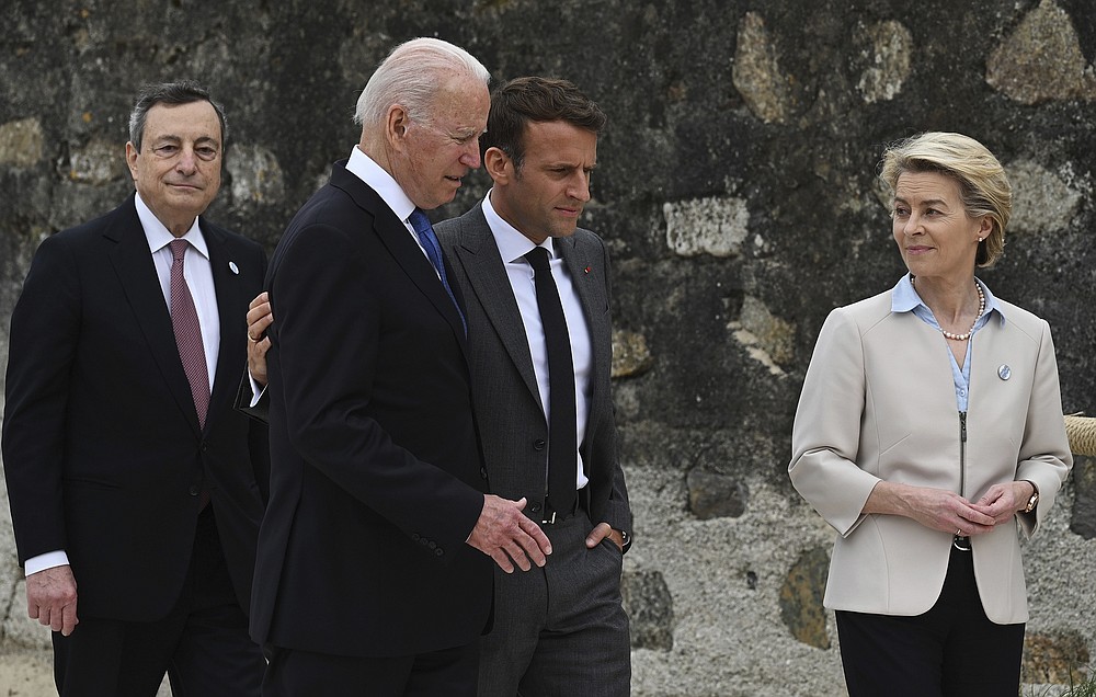 From left Italian Prime Minister Mario Draghi, US President Joe Biden, French President Emmanuel Macron and European Commission Ursula von der Leyen speak after they came for photos for the official welcome and group photo session of the heads of state during the G7 summit in Carbis Bay - and heads of government posed, Cornwall, England, Friday 11 June 2021. (Leon Neal / Pool Photo via AP)