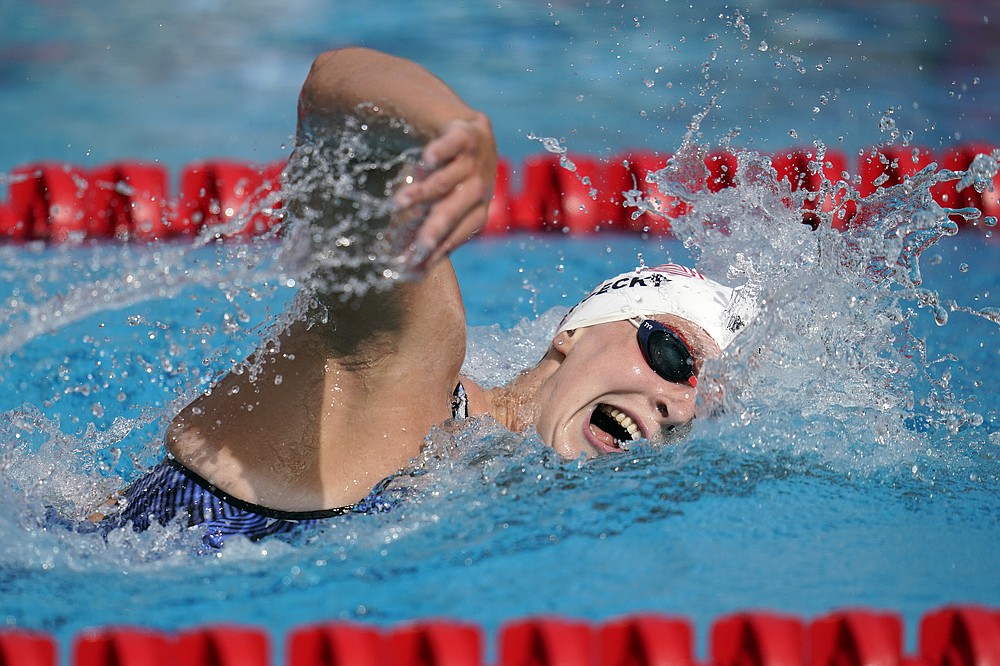 FILE - In this April 11, 2021, file photo, Katie Ledecky competes in the women's 1500-meter freestyle final at the TYR Pro Swim Series swim meet in Mission Viejo, Calif. Ledecky finished first. (AP Photo/Ashley Landis, File)
