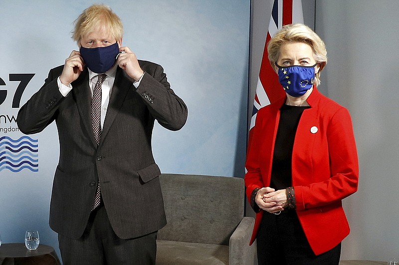 Britain's Prime Minister Boris Johnson meets with European Commission President Ursula von der Leyen during the G7 summit in Cornwall, England, Saturday June 12, 2021. (Peter Nicholls/Pool via AP)