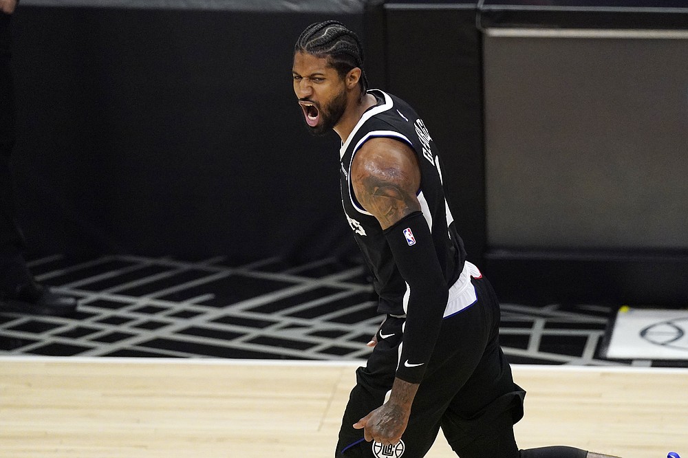 Los Angeles Clippers guard Paul George celebrates after hitting a three-point shot during the second half of Game 3 of a second-round NBA basketball playoff series against the Utah Jazz Saturday, June 12, 2021, in Los Angeles. (AP Photo/Mark J. Terrill)