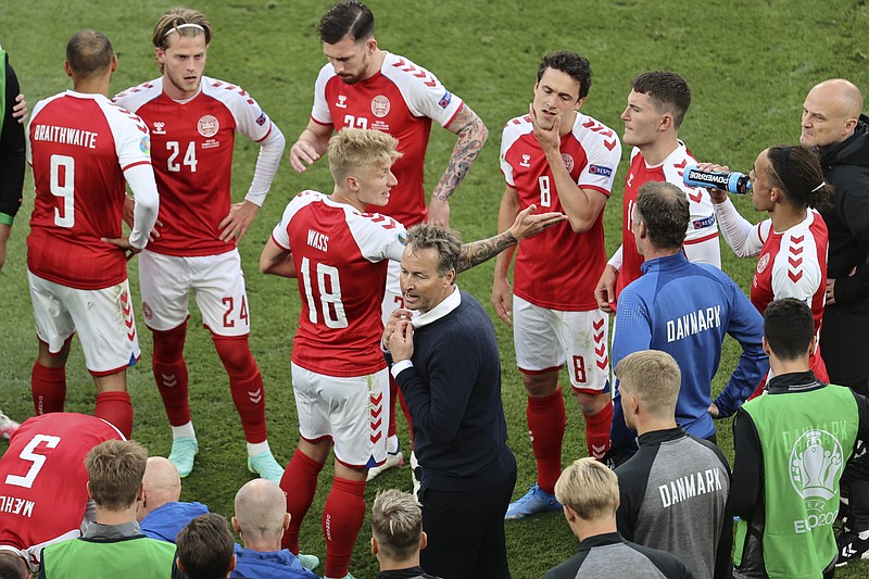 Denmark's manager Kasper Hjulmand instructs his players during the half time of the Euro 2020 soccer championship group B match between Denmark and Finland at Parken stadium in Copenhagen, Denmark, Saturday, June 12, 2021. (Wolfgang Rattay/Pool via AP)