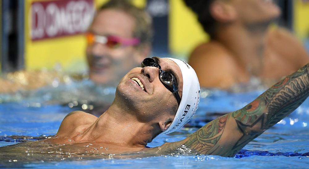 FILE - In this , Thursday, June 30, 2016, file photo, Anthony Ervin celebrates after swimming in the men's 100-meter freestyle final at the U.S. Olympic swimming trials in Omaha, Neb. Ervin is competing in the Olympic trials in Omaha, Neb., Sunday, June 13, 2021 (AP Photo/Mark J. Terrill, File)