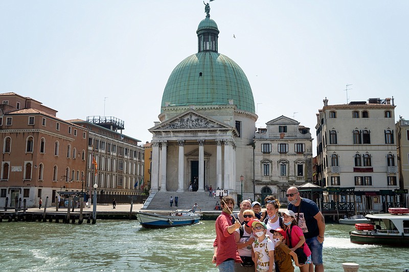 Tourists take a selfie on the Canal Grande in Venice on June 5. (Bloomberg/Giulia Marchi)