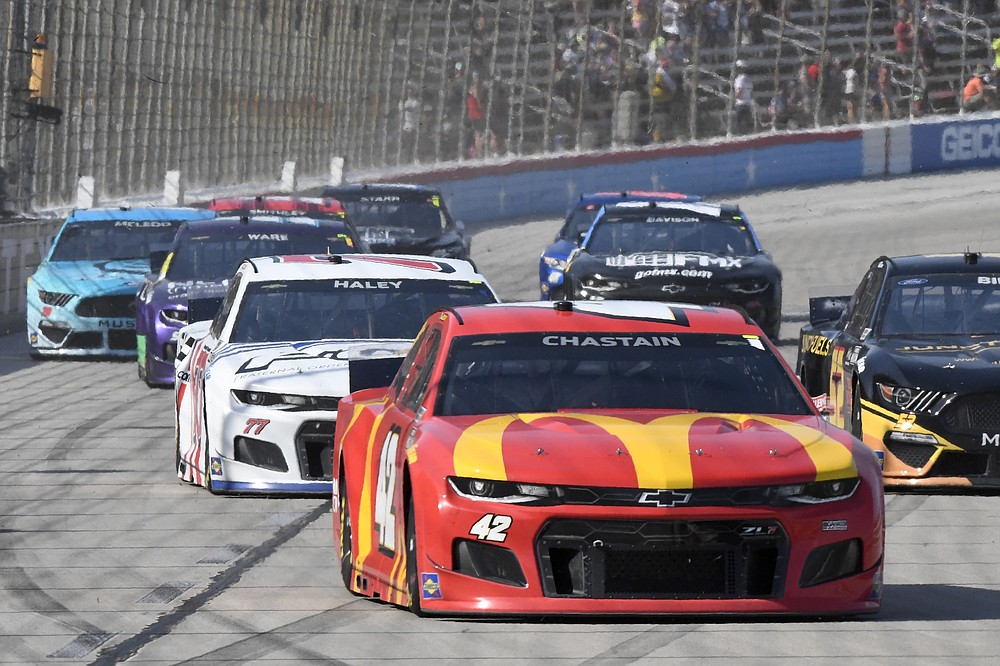 Ross Chastain (42) leads the field into Turn 1 during the NASCAR All-Star Open Cup series auto race at Texas Motor Speedway in Fort Worth, Texas, Sunday, June 13, 2021. (AP Photo/Larry Papke)