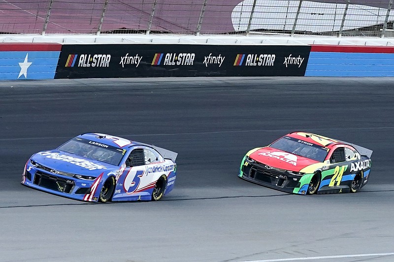 Kyle Larson (5) William Byron (24) head out of Turn 4 into the front stretch during the NASCAR Cup Series All-Star auto race at Texas Motor Speedway in Fort Worth, Texas, Sunday, June 13, 2021. (AP Photo/Tony Gutierrez)