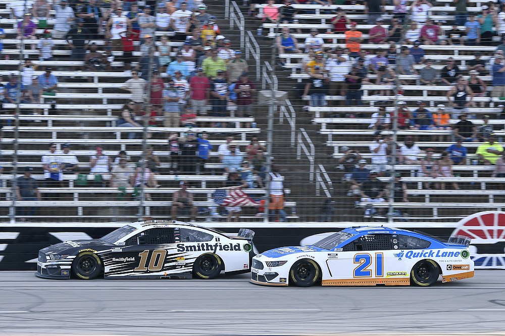 Aric Almirola (10) and Matt DiBenedetto (21) head down the front stretch during the NASCAR All-Star Open Cup Series auto race at Texas Motor Speedway in Fort Worth, Texas, Sunday, June 13, 2021. (AP Photo/Larry Papke)
