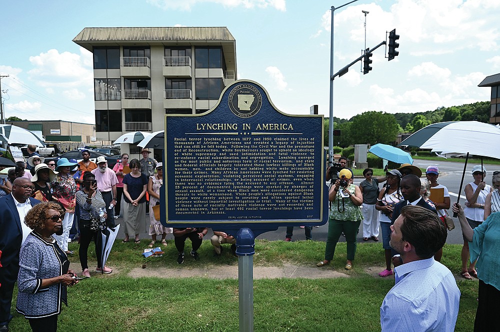 A crowd listens as the inscription is read aloud during the unveiling of a memorial marker for 1927 lynching victim John Carter on Sunday, June 13, 2021.. The Pulaski County Community Remembrance Project erected the memorial marker at Haven of Rest Cemetery, where Carter's remains are believed to be buried, as part of a continuing effort to erect memorial markers for known victims of lynchings throughout the state. The first marker was erected three weeks ago in Fayetteville, and a third is planned in Argenta in October. See more photos at arkansasonline.com/614memorial/

(Arkansas Democrat-Gazette/Stephen Swofford)
