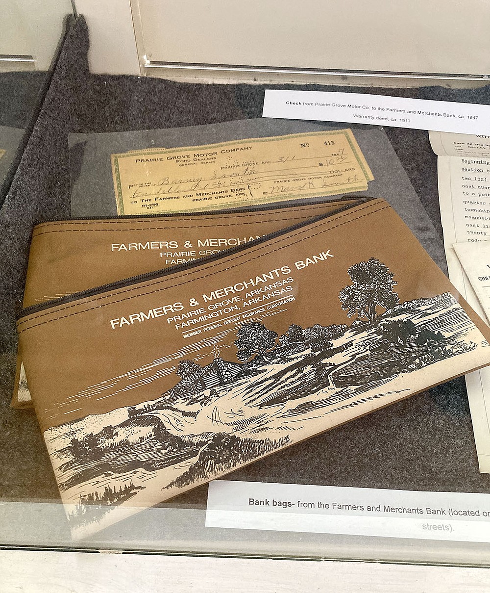 MAYLON RICE SPECIAL TO ENTERPRISE-LEADER These old bank bags from the former Farmers & Merchants Bank, once located in downtown Prairie Grove, can be seen at the Prairie Grove Heritage Museum. Farmers & Merchants Bank was acquired by Arvest Bank in 1992.