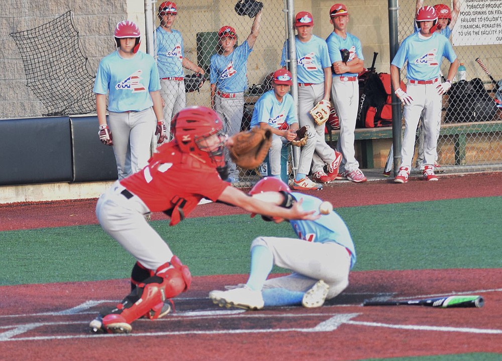 RICK PECK/SPECIAL TO MCDONALD COUNTY PRESS McDonald County catcher Brodie Roessler tries to bare-hand a loose ball to make a tag during the McDonald County 14U baseball team's 15-1 loss on June 10 to Webb City at Wendell Redden Stadium in Joplin.