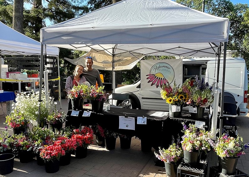 Farm to table — Flower Farmer Monica Drazba with husband, Tommy Stromberg, and their son, Oskar, started Midsummer Flowers after purchasing a small farm near Vacaville, Calif. They now sell their locally grown flowers weekly at the Vacaville Farmers Market. “It's been a joy connecting with the community this way.” (Courtesy of Monica Drazba)