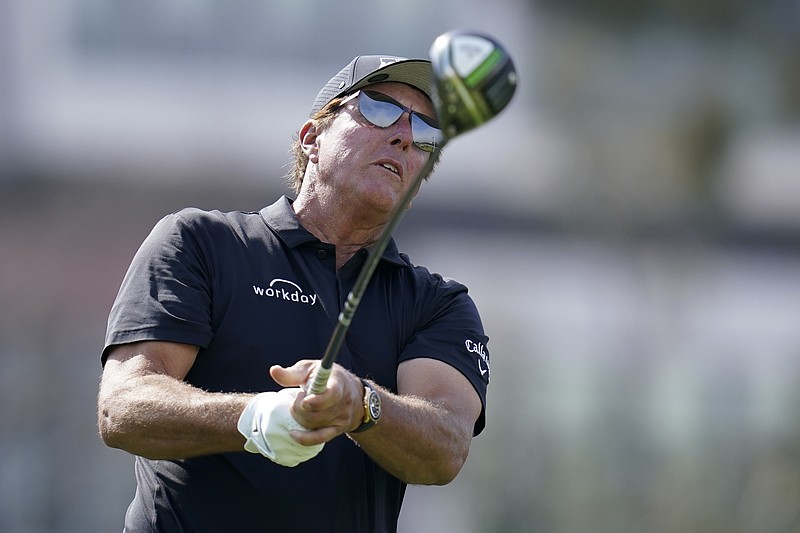 Phil Mickelson watches his tee shot on the 12th hole during a practice round of the U.S. Open Golf Championship Monday, June 14, 2021, at Torrey Pines Golf Course in San Diego. (AP Photo/Gregory Bull)