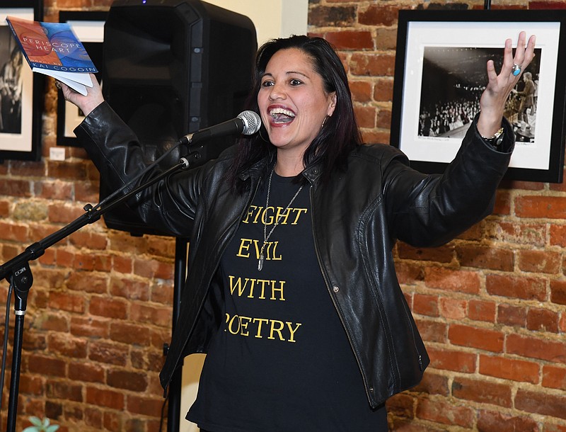 Local poet Kai Coggin reads from her book "Periscope Heart" during Wednesday Night Poetry in January 2019. - File photo by The Sentinel-Record