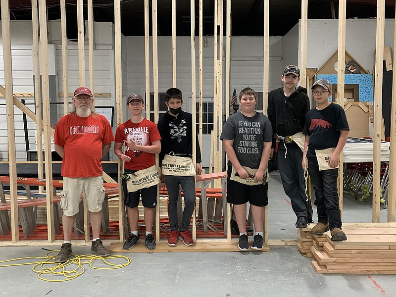 PHOTOS BY ALEXUS UNDERWOOD/SPECIAL TO MCDONALD COUNTY PRESS Kaufman's morning carpentry class. The class, posing in the theater building they're renovating, includes (from left to right) Mark Kaufman, James Kopejtka, Roberto Rosillo, Walker Carriger, Dominic Blackwell, and Kenneth Zinn.