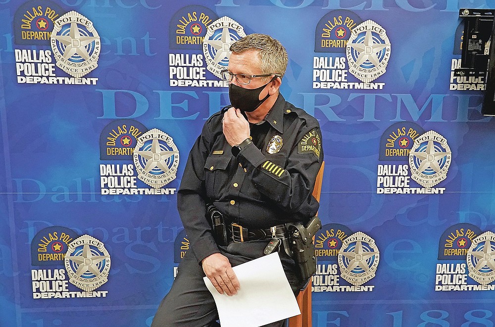 In this May 11, 2021, photo wearing a mask to prevent the spread of COVID-19, Dallas deputy police chief William Griffith prepares for an interview about recruiting cadets for the department in Dallas. (AP Photo/LM Otero)