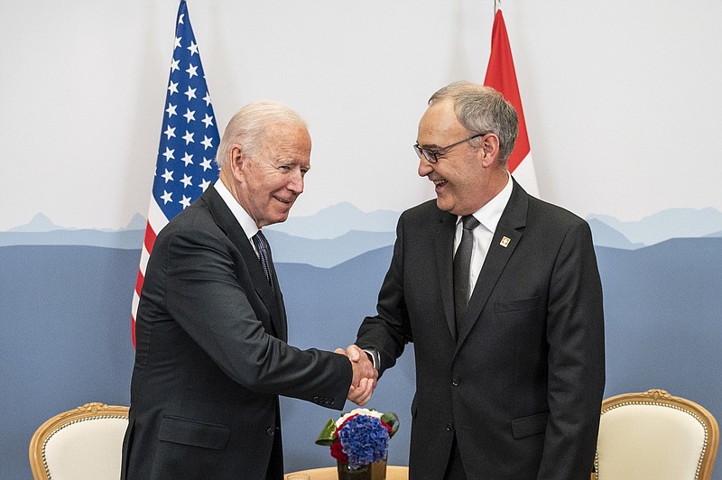 Swiss Federal president Guy Parmelin, right, welcomes US president Joe Biden, left, in Geneva, Switzerland, Tuesday, June 15, 2021 one day before the US - Russia summit. The meeting between US President Joe Biden and Russian President Vladimir Putin is scheduled in Geneva for Wednesday, June 16, 2021. (Alessandro della Valle/Keystone via AP, Pool)