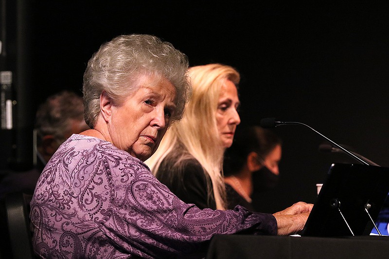 Little Rock board member Joan Adcock (left) listens to debate during the Little Rock City Board meeting on Tuesday, June 15, 2021, at Little Rock Southwest High School. 
(Arkansas Democrat-Gazette/Thomas Metthe)