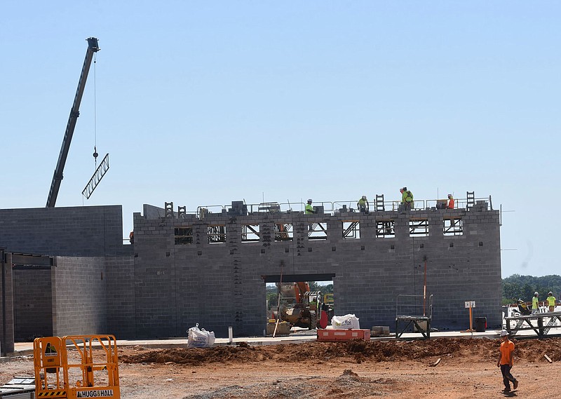 Workers make progress Tuesday on a new Bentonville School District elementary school along Barron Road northeast of the Benton County Fairgrounds. It is the 13th elementary school for the district. Go to nwaonlin.com/210616Daily/ to see more photos.
(NWA Democrat-Gazette/Flip Putthoff)