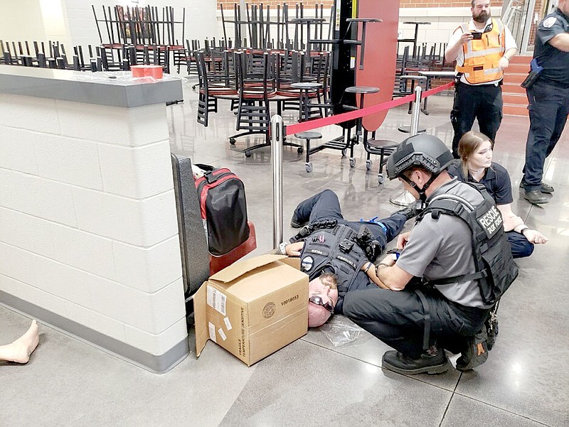 COURTESY PHOTO
First responders from many agencies in Washington and Benton counties participate in an active shooter or "aggressive person" drill at Farmington High School.