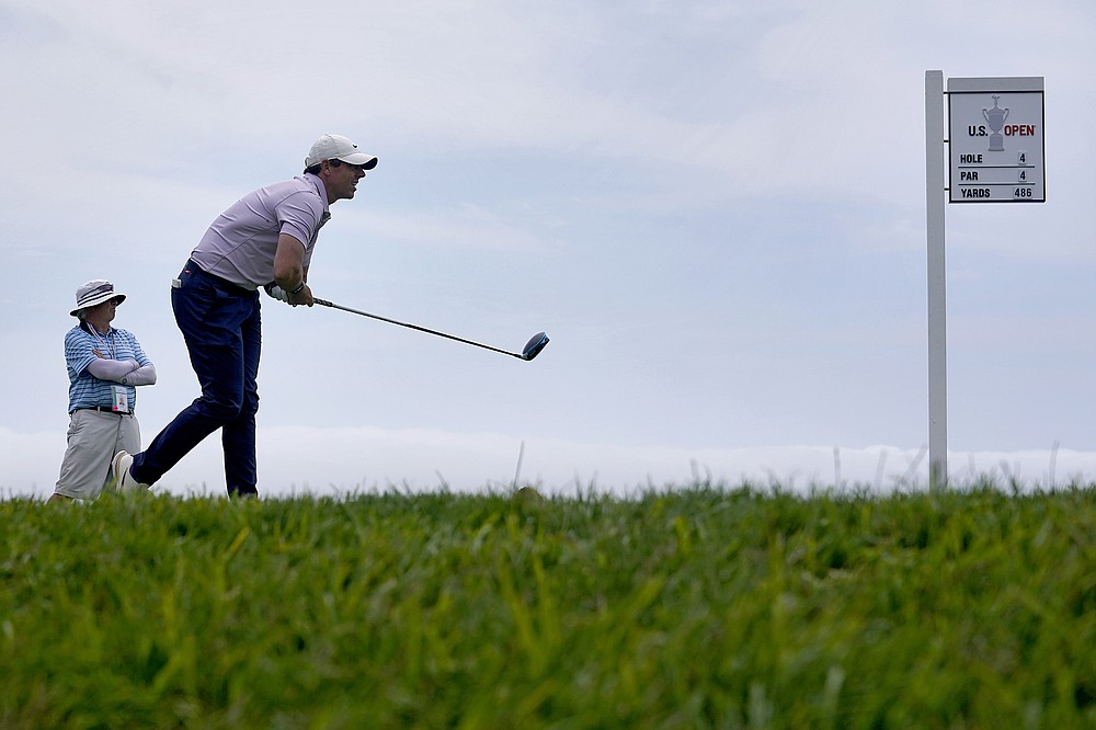Rory McIlroy, of Northern Ireland, watches his shot from the 14th tee during a practice round of the U.S. Open Golf Championship, Wednesday, June 16, 2021, at Torrey Pines Golf Course in San Diego. (AP Photo/Marcio Jose Sanchez)