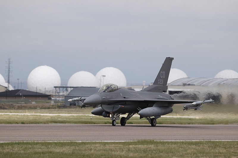 A General Dynamics F-16 Fighting Falcon from Colorado Air National Guard's 140th Wing takes off from Buckley Air Force Base on May 15, 2020, in Aurora, Colo. Fort Smith city directors on Tuesday committed money from the city's general fund for a runway extension to accommodate a Singaporean F-16 training unit at Ebbing Air National Guard Base. 
(File Photo/AP/David Zalubowski)