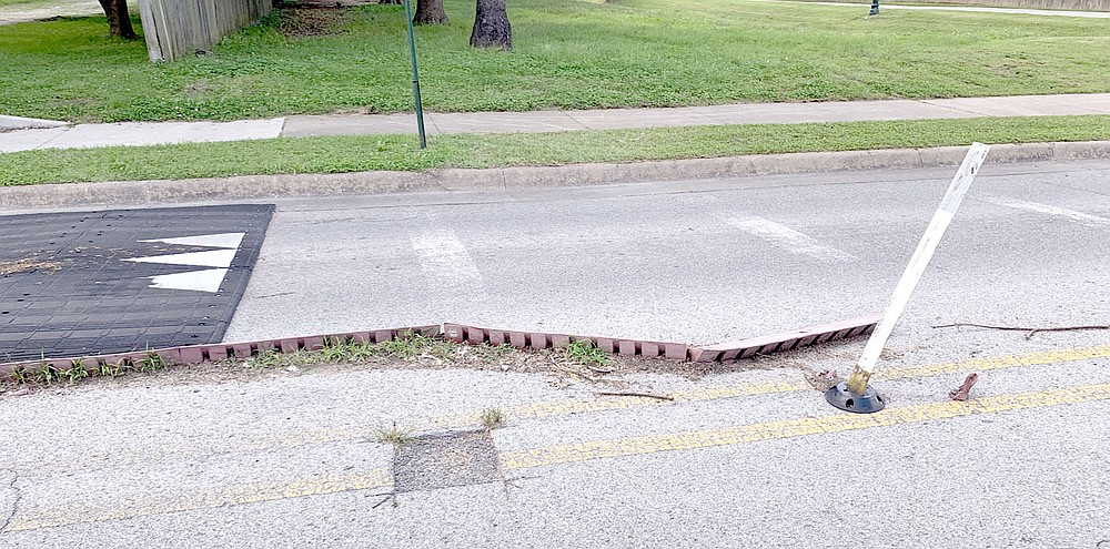 Photo submitted Director David Allen took a picture of the crumbling speed table at the intersection of South Carl Street and West Harvard Street. Allen said he took the photo to show how the speed table was not maintained. Director Mindy Hunt also said vehicles have been driving around the speed table defeating the purpose of them.