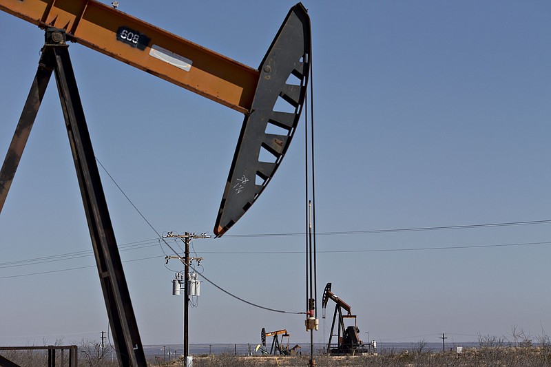 Pumpjacks operate on oil wells in the Permian Basin near Crane, Texas, on March 2, 2018. MUST CREDIT: Bloomberg photo by Daniel Acker.