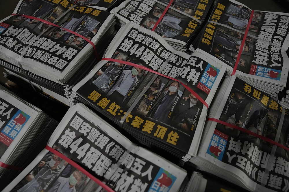 Copies of Apple Daily newspaper are packed at the printing house in Hong Kong, early Friday, June 18, 2021. Five editors and executives at pro-democracy Apple Daily newspaper were arrested Thursday under Hong Kong's national security law, its stock was halted and police were searching its offices in moves raising concerns about the media's future in the city. (AP Photo/Kin Cheung)