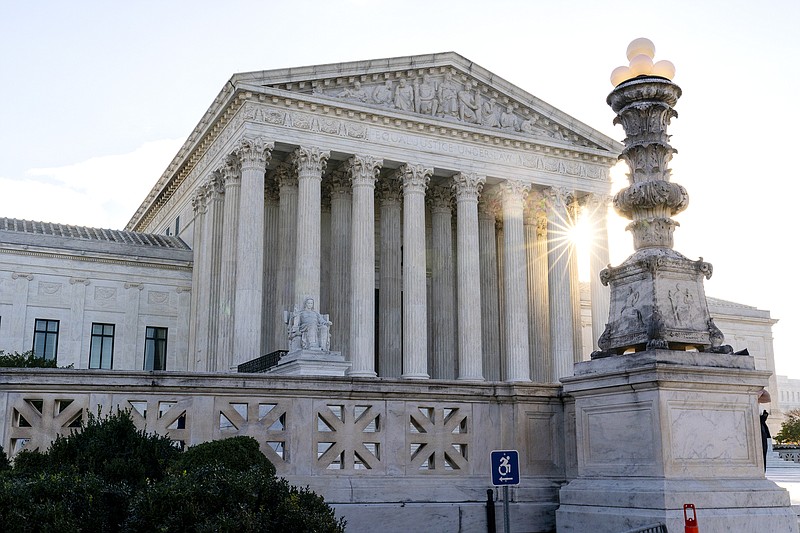 FILE - In this Nov. 10, 2020, file photo the sun rises behind the U.S. Supreme Court in Washington.  (AP Photo/Alex Brandon, File)