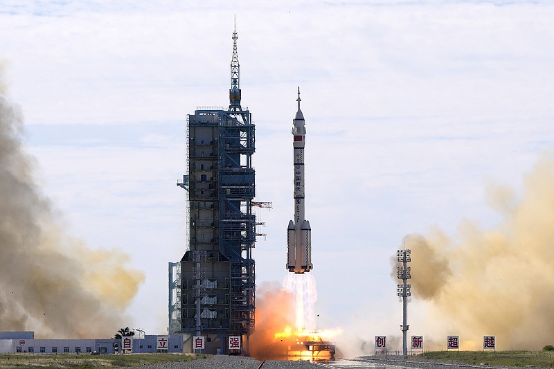 A Long March-2F Y12 rocket carrying a crew of Chinese astronauts in a Shenzhou-12 spaceship lifts off at the Jiuquan Satellite Launch Center in Jiuquan in northwestern China, Thursday. China has launched the first three-man crew to its new space station in its the ambitious programs first crewed mission in five years. - AP Photo/Ng Han Guan