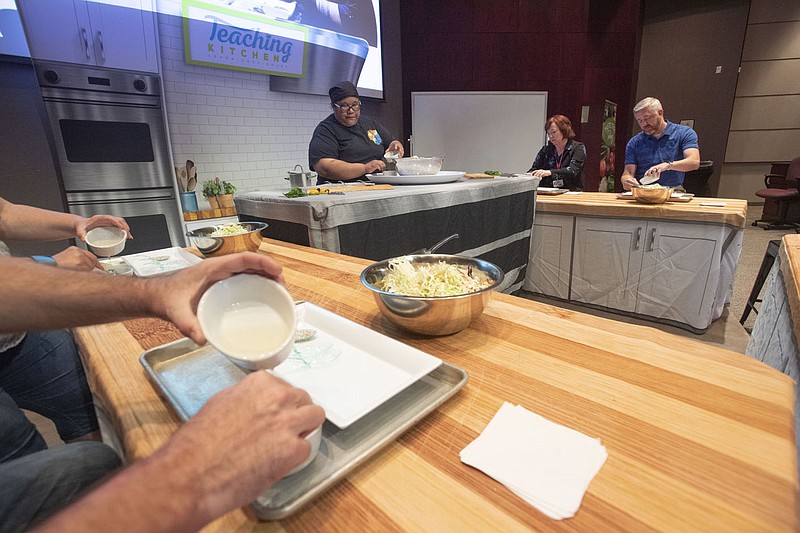 Chef Judy Tatios leads a demonstration about how to make coleslaw Thursday June 17, 2021 during a a health summit for school superintendents and heads of child nutrition hosted by the Northwest Arkansas Council at the University of Arkansas in Fayetteville. Tatios is from southern California but calls Northwest Arkansas home now where she specializes in Marshallese cuisine. Visit nwaonline.com/2100618Daily/ and nwadg.com/photo. (NWA Democrat-Gazette/J.T. Wampler)