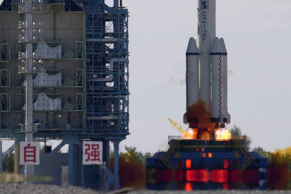 A Long March-2F Y12 rocket carrying a crew of Chinese astronauts in a Shenzhou-12 spaceship lifts off at the Jiuquan Satellite Launch Center in Jiuquan in northwestern China, Thursday, June 17, 2021. China has launched the first three-man crew to its new space station in its the ambitious programs first crewed mission in five years. (AP Photo/Ng Han Guan)