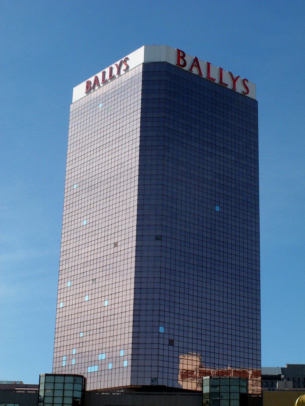 This Oct. 1, 2020 photo shows the exterior of Bally's casino in Atlantic City N.J.  The new owners of Bally's Atlantic City are attempting to revive a comatose casino in perhaps the most cutthroat gambling market in America. Rhode Island-based Bally's Corporation is spending at least $90 million on the Boardwalk casino over the next five years, including hotel room makeovers, a renovation of the casino floor, new slot machines and restaurants, and more live entertainment.  (AP Photo/Wayne Parry)