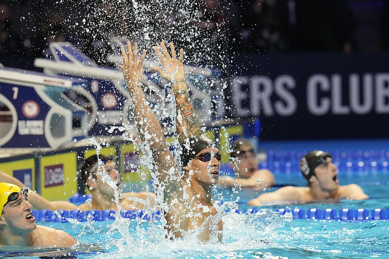 Caeleb Dressel reacts after winning the men's 100 freestyle during wave 2 of the U.S. Olympic Swim Trials on Thursday, June 17, 2021, in Omaha, Neb. (AP Photo/Jeff Roberson)