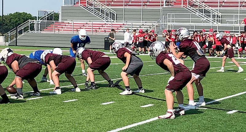 Photo submitted
The Siloam Springs offense goes against Rogers on Wednesday during team camp at Farmington.