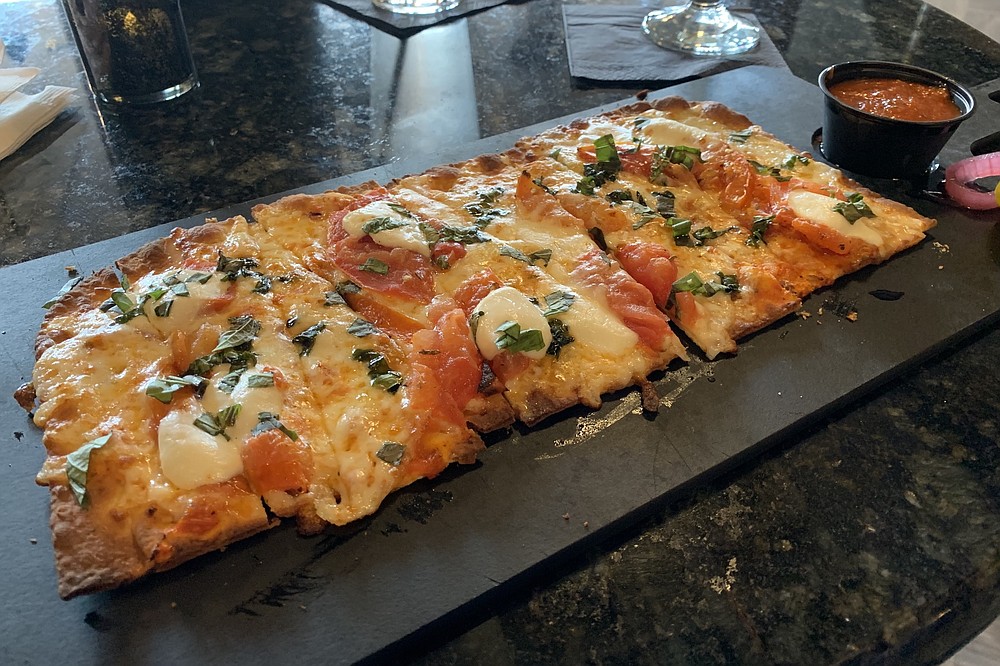 The Margherita Flabread is one of three pizza-like flatbreads on Cannibal & Craft's menu. (Arkansas Democrat-Gazette/Eric E. Harrison)
