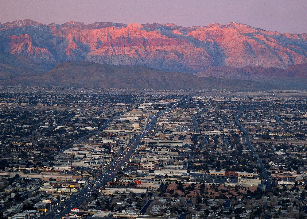 FILE - In this Feb. 9, 2005, file photo, shows the suburbs of Las Vegas from atop the Stratosphere tower looking west down Sahara Ave., towards the Spring Mountains. Despite drought, cities in the U.S. West expect their populations to grow considerably in the coming decades. From Phoenix to Boise, officials are working to ensure they have the resources, infrastructure and housing supply to meet growth projections. In certain parts of the region, their efforts are constrained by the fact that sprawling metro areas are surrounded by land owned by the federal government. U.S. Sen. Catherine Cortez Masto wants to remedy the issue in Las Vegas by strengthening protections for some public lands while approving the sale of others to commercial and residential developers. (AP Photo/Joe Cavaretta, File)