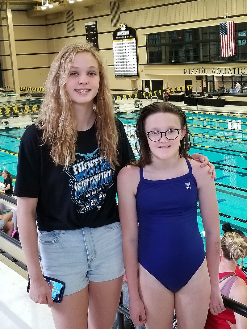 Emma Crowe, left, and Aubrey Schmitt recently competed at the USA-Columbia Swim Club Invitational at the University of Missouri-Columbia. - Submitted photo