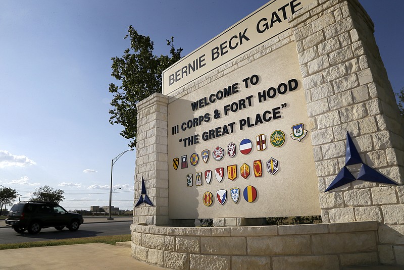 In this July 9, 2013, file photo, traffic flows through the main gate past a welcome sign in Fort Hood, Texas. A new study finds that female soldiers at Army bases in Texas, Colorado, Kansas and Kentucky face a greater risk of sexual assault and harassment than those at other posts, accounting for more than a third of all active duty Army women sexually assaulted in 2018. The study by RAND Corporation was released Friday. - AP Photo/Tony Gutierrez