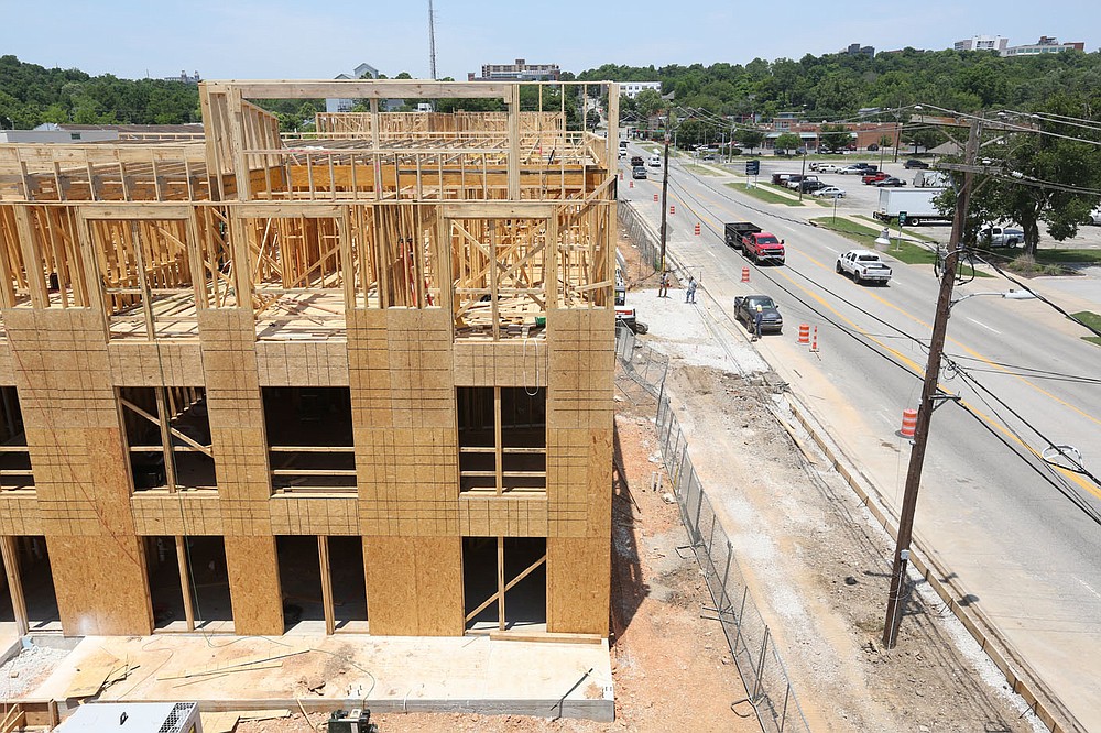 A view of the apartment construction from the third floor Thursday, June 17, 2021, at the South Yard in Fayetteville. The project lies between elements of the city's U.S. 71B corridor project to the east and the University of Arkansas Windgate Art and Design District to the west, and plans to open apartments for lease early next year. Check out nwaonline.com/210620Daily/ and nwadg.com/photos for a photo gallery.
(NWA Democrat-Gazette/David Gottschalk)