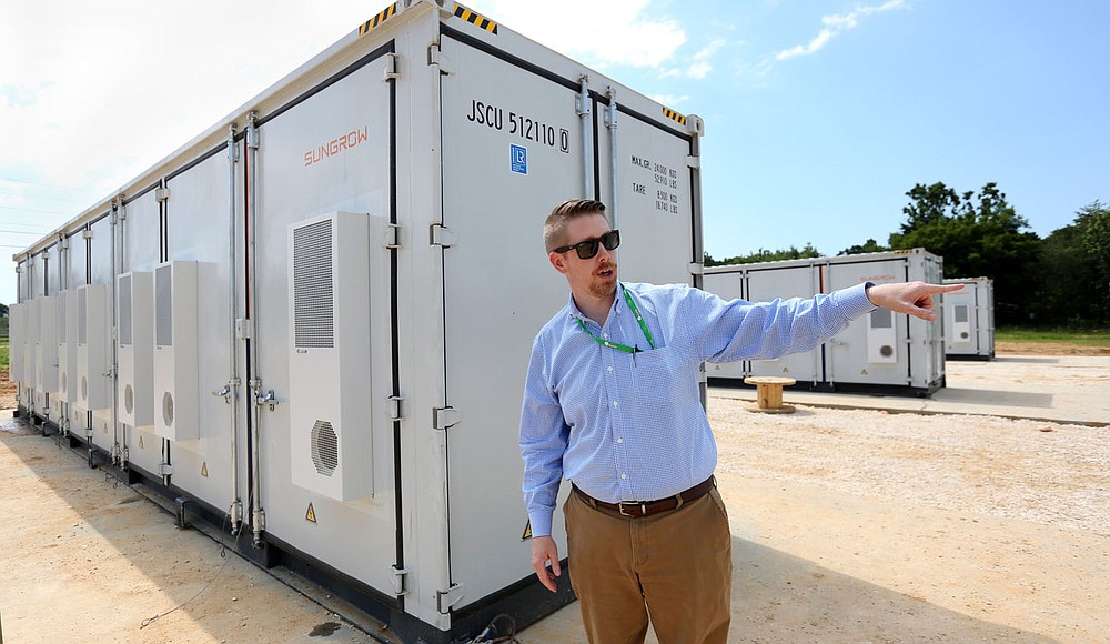 Todd Clouse, Director of Energy Services at Ozark Electric Cooperative, describes on Wednesday, June 15, 2021, the battery storage units and control boxes for the new solar farm being built by Ozark Electric Cooperative and Today's Power Inc. near Lincoln .  The 25-acre park will serve five entities with 2.7 megawatts of solar panels.  See nwaonline.com/210620Daily/ and nwadg.com/photos for a photo gallery.  (NWA Democrat-Gazette / David Gottschalk)