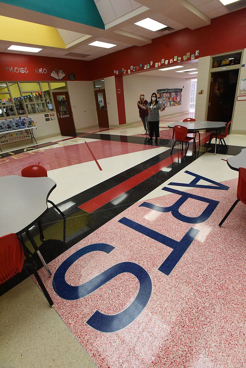 Lindsay Hennarichs (left), assistant principal, and Regina Stewman, principal show a commons area at Sonora Elementary that will be redone to be more useful to students. The area is callled a parliament, after a pariliament of owls, Stewman said.
(NWA Democrat-Gazette/Flip Putthoff)