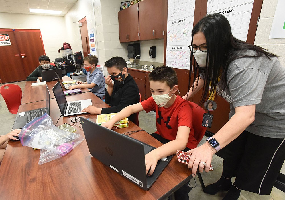 Regina Stewman, principal, visits with students on Friday April 9 2021 at Sonora Elementary in Springdale. The school is on a five-year plan to become a school of innovation.
(NWA Democrat-Gazette/Flip Putthoff)