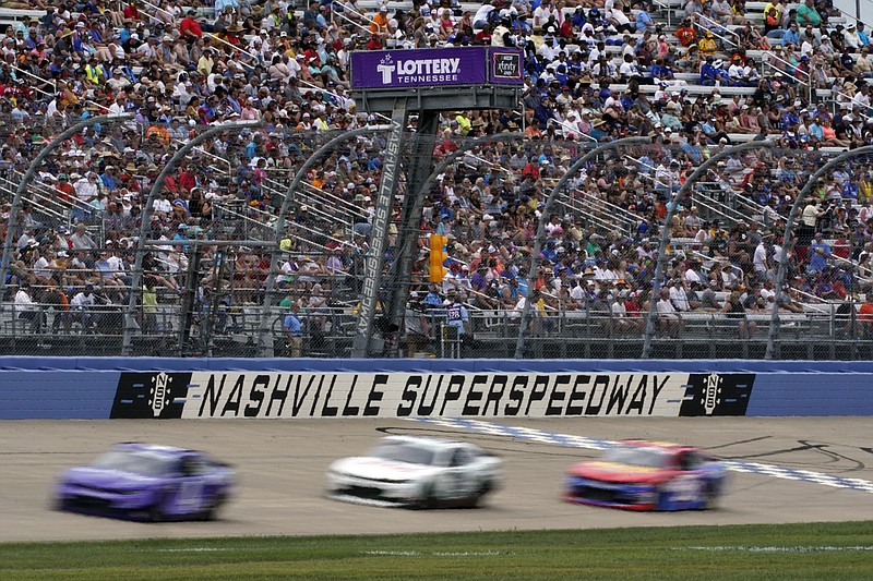 Cars come down the main straightaway at Nashville Superspeedway during Saturday's NASCAR Xfinity Series race in Lebanon, Tenn. - Photo by Mark Humphrey of The Associated Press